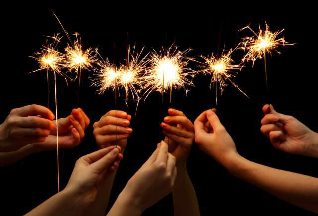 Friends holding fireworks sparklers